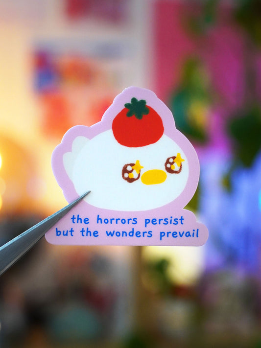 the horrors persist, but the wonders prevail 🍅 sticker